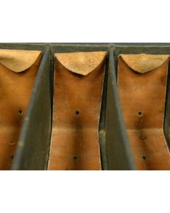 “Leather cartridge magazine for shotgun shell storage and quick access in the field”

