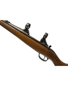 CZ 357 7x57 bolt-action hunting rifle with walnut stock and iron sights

