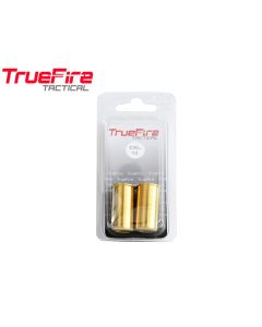 TrueFire brass snap caps lined up on bench

